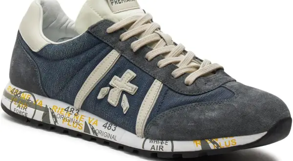 Buty Premiata, znana włoska marka, prezentują stylowe sneakersy z denimu i zamszu.